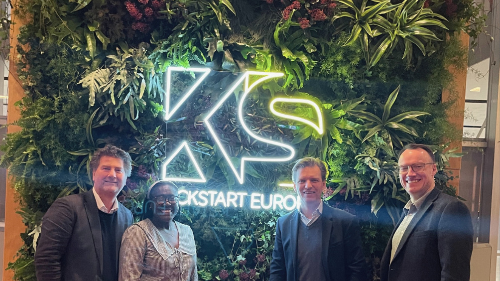 Team Soben, Pete Alexander, Helena Mubiru, Pieter Schaap, Tom Sturt, on the foreground of the Kickstart europe logo.